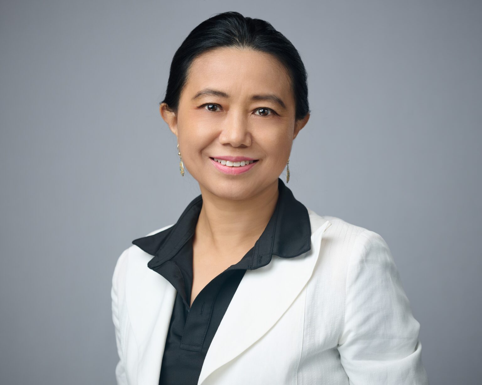 Michelle Chen, Ph.D. in a studio portrait wearing a navy outfit