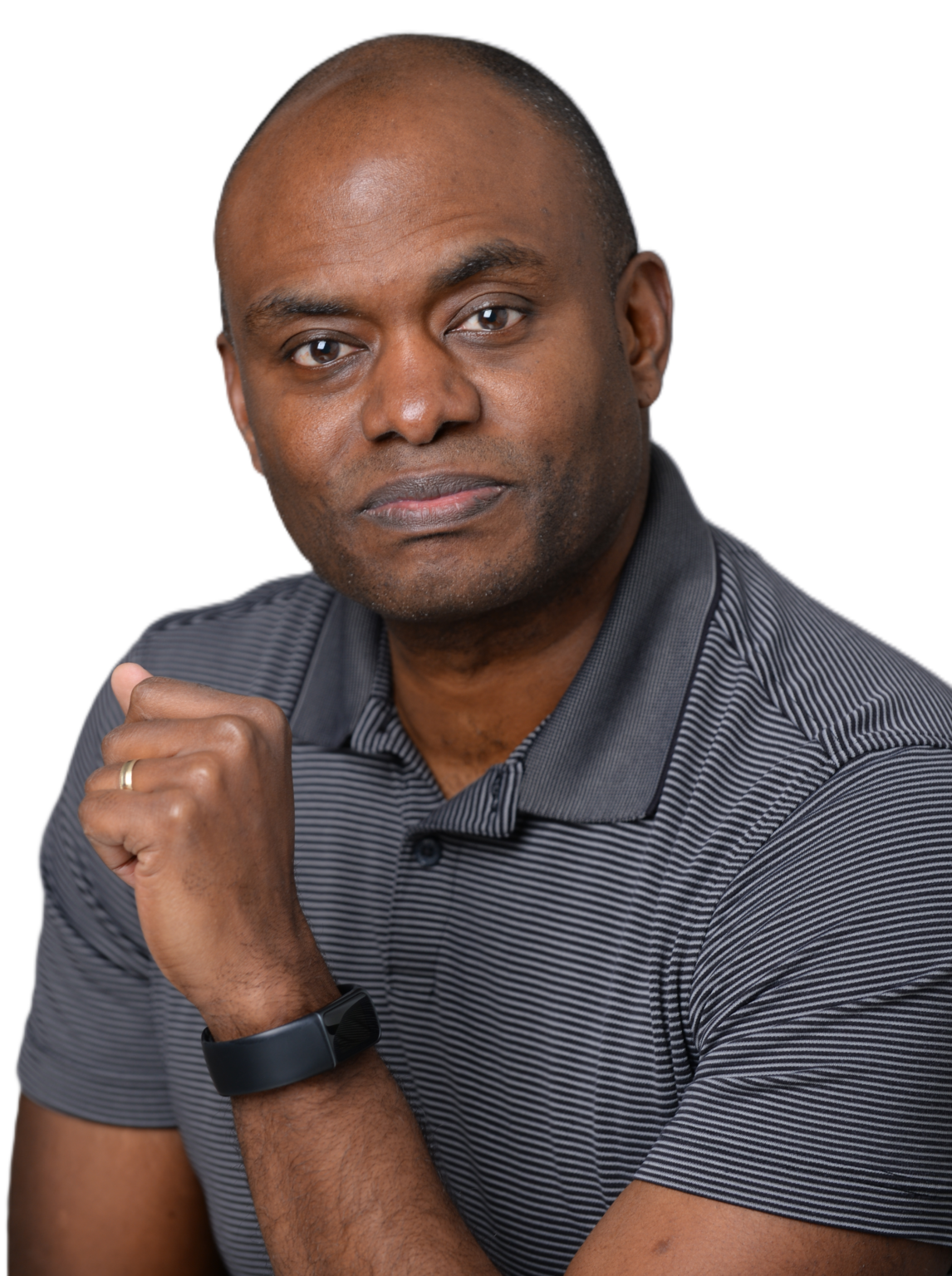 Darren Mann in a grey striped polo with a hand raised to his chin against a white background